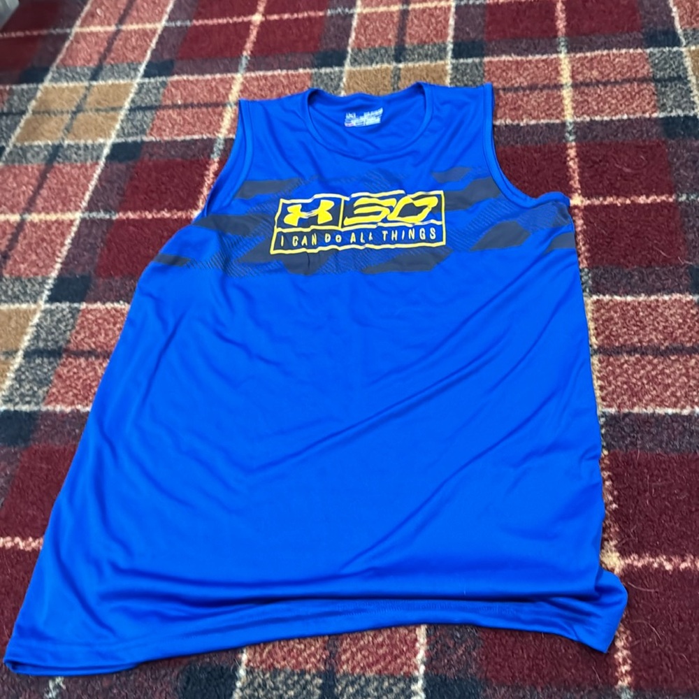 Boys youth XL under Armour curry sleeveless shirt. Never worn.